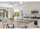 Bright kitchen with island and barstool seating, stainless steel appliances, and lots of countertop space at 20438 W Calle Encorvada --, Buckeye, AZ 85396