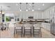 Modern kitchen with stainless steel appliances, granite countertops, a kitchen island and white cabinets at 20438 W Calle Encorvada --, Buckeye, AZ 85396
