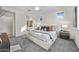 Main bedroom features large bed, carpeted floors, and lots of natural light at 20438 W Calle Encorvada --, Buckeye, AZ 85396