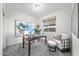 Inviting home office with a comfortable chair, decorative artwork, and ample natural light from the window at 20438 W Calle Encorvada --, Buckeye, AZ 85396