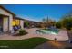 Backyard pool with patio, grill, and desert landscaping providing a comfortable entertainment area at 20438 W Calle Encorvada --, Buckeye, AZ 85396