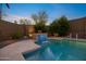 Backyard pool with lush landscaping and a charming water feature offers a serene retreat at 20438 W Calle Encorvada --, Buckeye, AZ 85396