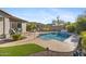 Beautiful backyard pool with stone trim, lush landscaping, and an outdoor grill ideal for relaxation at 20438 W Calle Encorvada --, Buckeye, AZ 85396