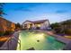 Backyard with a pool, covered patio, and landscaped area providing a perfect setting for entertainment at 20438 W Calle Encorvada --, Buckeye, AZ 85396