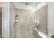 Shower with dual shower heads, a built-in seat, and a grab bar for increased safety and accessibility at 20438 W Calle Encorvada --, Buckeye, AZ 85396