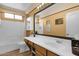 Well-lit bathroom features a shower-tub combo, a large mirror, and contemporary fixtures at 2069 E Winchester Way, Chandler, AZ 85286