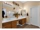 Bathroom featuring dual sinks and a large mirror at 2069 E Winchester Way, Chandler, AZ 85286