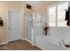 Bathroom with large tub and separate glass shower at 2069 E Winchester Way, Chandler, AZ 85286