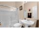 Bathroom featuring glass shower, toilet, and sink with contemporary fixtures and towel rack at 2069 E Winchester Way, Chandler, AZ 85286