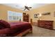 Bedroom with rustic wood furnishings and tile flooring at 2069 E Winchester Way, Chandler, AZ 85286