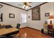 Bedroom with ceiling fan, wood flooring, natural light, and plantation shutters at 2069 E Winchester Way, Chandler, AZ 85286
