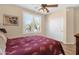 Bedroom featuring a ceiling fan and a window with shutters at 2069 E Winchester Way, Chandler, AZ 85286