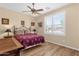 Bedroom featuring wood laminate flooring and ceiling fan at 2069 E Winchester Way, Chandler, AZ 85286