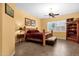 Cozy bedroom with wood-frame bed, ceiling fan and tile flooring at 2069 E Winchester Way, Chandler, AZ 85286