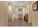 Bright foyer featuring tiled flooring, stylish lighting, and decorative accents, creating a welcoming entrance at 2069 E Winchester Way, Chandler, AZ 85286