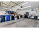 Spacious garage with overhead lighting, shelving and ample storage space at 2069 E Winchester Way, Chandler, AZ 85286