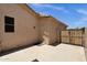 View of home exterior with door to storage and gate to driveway at 2069 E Winchester Way, Chandler, AZ 85286