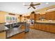 Kitchen featuring granite countertops, ample cabinetry, and modern appliances with a breakfast nook at 2069 E Winchester Way, Chandler, AZ 85286