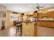 Spacious kitchen with an island bar, ample cabinets, and eat-in breakfast area with lots of natural light at 2069 E Winchester Way, Chandler, AZ 85286