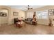 Comfortable living room with tile flooring, neutral walls, a sofa, arm chair, and shuttered windows at 2069 E Winchester Way, Chandler, AZ 85286