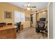 Bright office space with two desks and wood laminate flooring at 2069 E Winchester Way, Chandler, AZ 85286