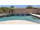 Beautiful pool featuring cascading waterfall feature and lush tropical landscaping at 2069 E Winchester Way, Chandler, AZ 85286