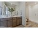 Contemporary bathroom with double vanity, a large mirror, and a walk-in shower with glass door at 2121 W Sonoran Desert Dr # 86, Phoenix, AZ 85085
