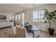 Bright dining area with modern table, chairs and plant offers a relaxing place to enjoy meals at 2121 W Sonoran Desert Dr # 86, Phoenix, AZ 85085