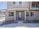 Townhouse with stylish exterior featuring a modern front door, stone accents, and attractive landscaping at 2121 W Sonoran Desert Dr # 86, Phoenix, AZ 85085