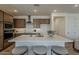 Stylish kitchen featuring a large island, stainless steel appliances, and modern cabinets at 2121 W Sonoran Desert Dr # 86, Phoenix, AZ 85085