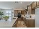 Gourmet kitchen featuring stainless steel appliances, ample cabinetry, and a large center island at 2121 W Sonoran Desert Dr # 86, Phoenix, AZ 85085