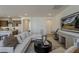 Comfortable living room with neutral tones, contemporary decor, and seamless kitchen access at 2121 W Sonoran Desert Dr # 86, Phoenix, AZ 85085