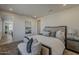 Serene bedroom suite featuring soft carpeting, a king bed, and access to the ensuite bathroom at 2121 W Sonoran Desert Dr # 86, Phoenix, AZ 85085