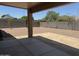 Large backyard features a neutral gravel ground cover and block wall fencing for privacy at 2213 N Ashbrook Cir, Mesa, AZ 85213
