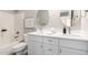 Bright bathroom featuring white cabinetry, bathtub with shower, and modern fixtures at 2213 N Ashbrook Cir, Mesa, AZ 85213