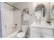 Bathroom featuring a white vanity, oval mirror, and bathtub with shower at 2213 N Ashbrook Cir, Mesa, AZ 85213