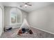 Playful bedroom featuring a teepee and decorative rug at 2213 N Ashbrook Cir, Mesa, AZ 85213