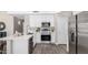 Modern kitchen with white cabinets and stainless steel appliances at 2213 N Ashbrook Cir, Mesa, AZ 85213