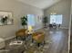 Comfortable living area with vaulted ceilings, modern furniture, and bright natural light at 2213 N Ashbrook Cir, Mesa, AZ 85213