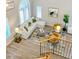 Bright living room with large windows, white sectional sofa, and modern decor elements at 2213 N Ashbrook Cir, Mesa, AZ 85213