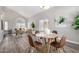 Open-concept living room with vaulted ceilings, wood floors, and lots of natural light at 2213 N Ashbrook Cir, Mesa, AZ 85213