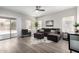 Comfortable living room with a ceiling fan and a sliding door to the backyard at 2213 N Ashbrook Cir, Mesa, AZ 85213