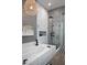 Bathroom featuring bathtub, black-and-white tiled shower, and neutral color palette at 26885 N 104Th Pl, Scottsdale, AZ 85262
