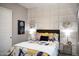 Comfortable bedroom features a decorative accent wall with stylish floral bedding and complementary bedside decor at 26885 N 104Th Pl, Scottsdale, AZ 85262