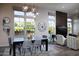 Cozy dining area with stylish decor, large windows, and an open layout at 26885 N 104Th Pl, Scottsdale, AZ 85262