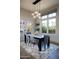 Well-lit dining area with stylish decor and natural light streaming in through large windows at 26885 N 104Th Pl, Scottsdale, AZ 85262