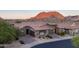 Beautiful desert home with brick driveway and stone accents, set against a majestic mountain backdrop at 26885 N 104Th Pl, Scottsdale, AZ 85262