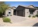 Charming single-Gathering home with a stone facade, tile roof, desert landscaping, and a two-car garage at 26885 N 104Th Pl, Scottsdale, AZ 85262