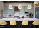 Bright kitchen with a large quartz island, stainless steel appliances, and a modern design at 26885 N 104Th Pl, Scottsdale, AZ 85262