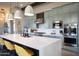 Well-equipped kitchen featuring stainless steel appliances, a large quartz island, and ample cabinet space at 26885 N 104Th Pl, Scottsdale, AZ 85262